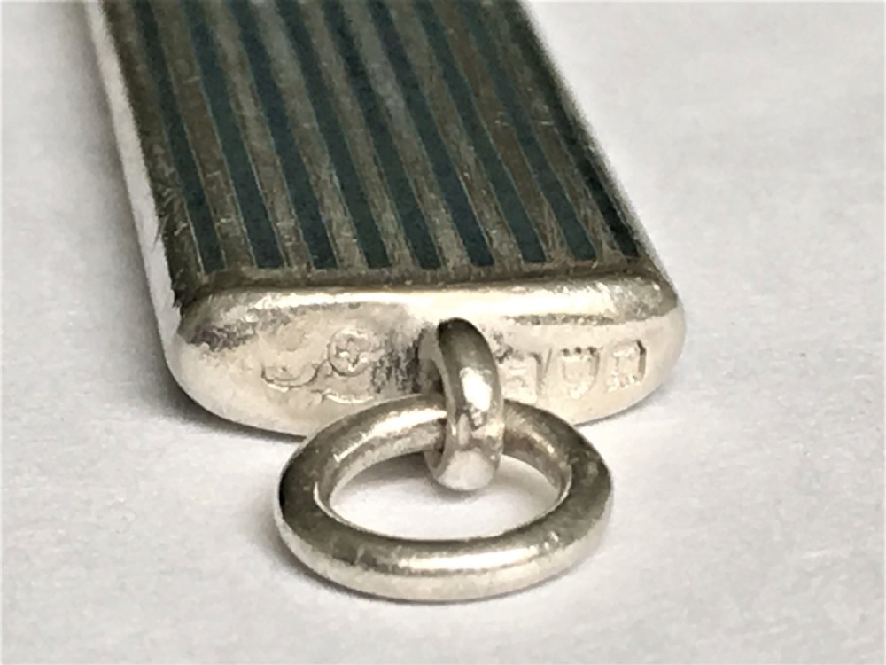 A rare silver and enamel whistle View V