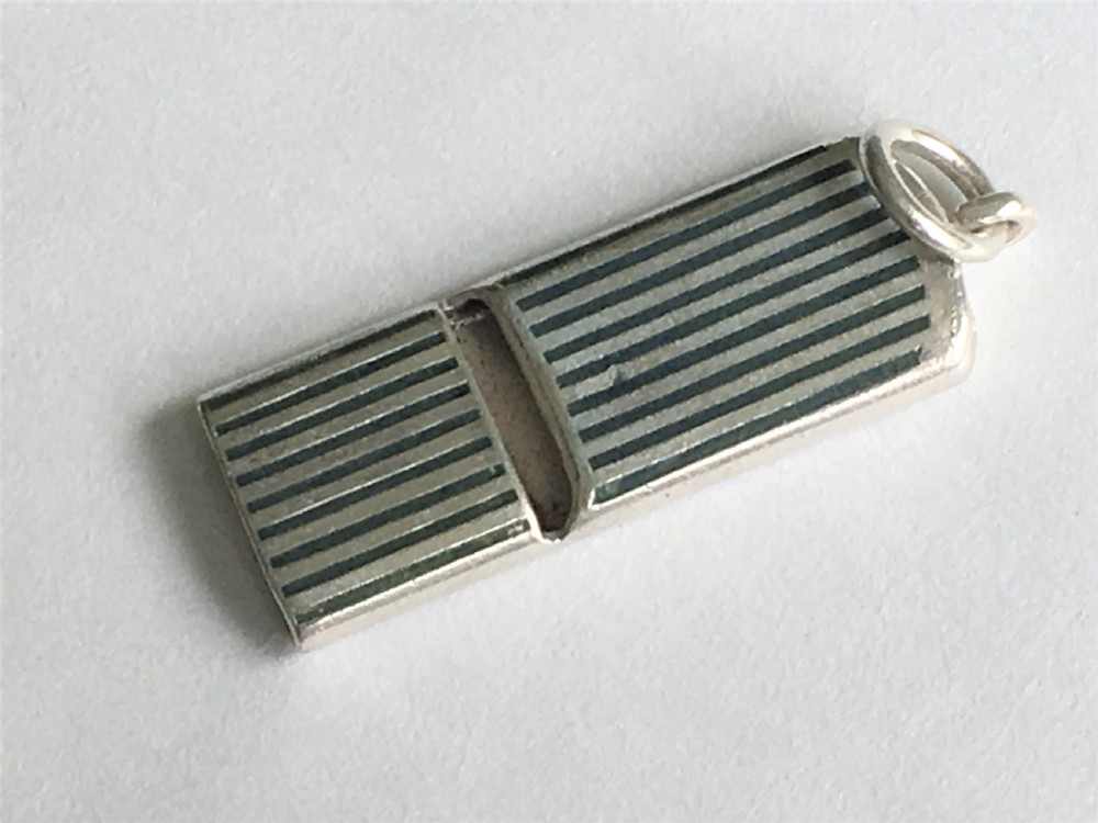 A rare silver and enamel whistle View VI