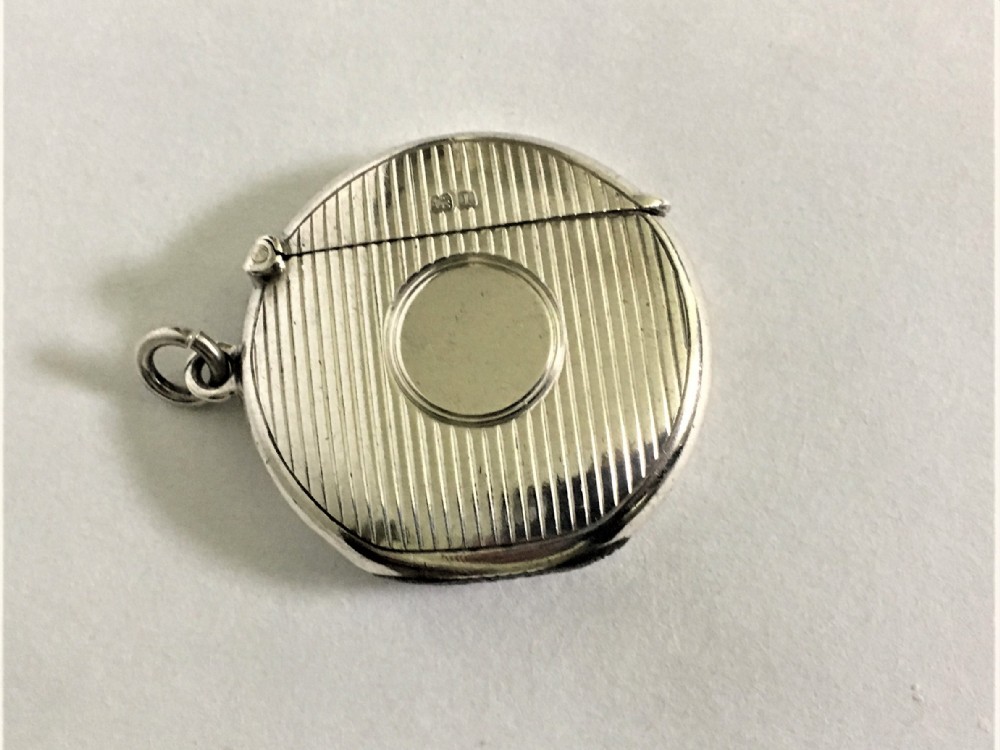 A rare Edwardian silver circular vesta