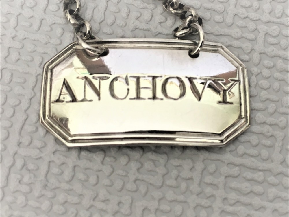An 18th Century silver 'anchovy' label View II