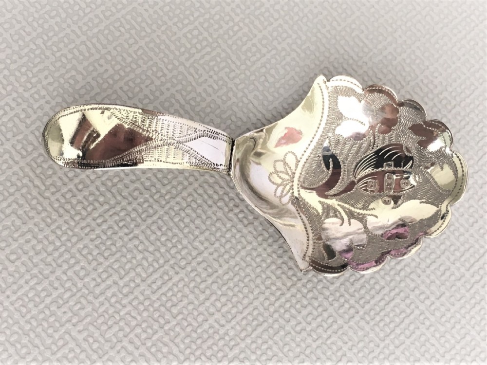 A gorgeous William IV silver caddy spoon