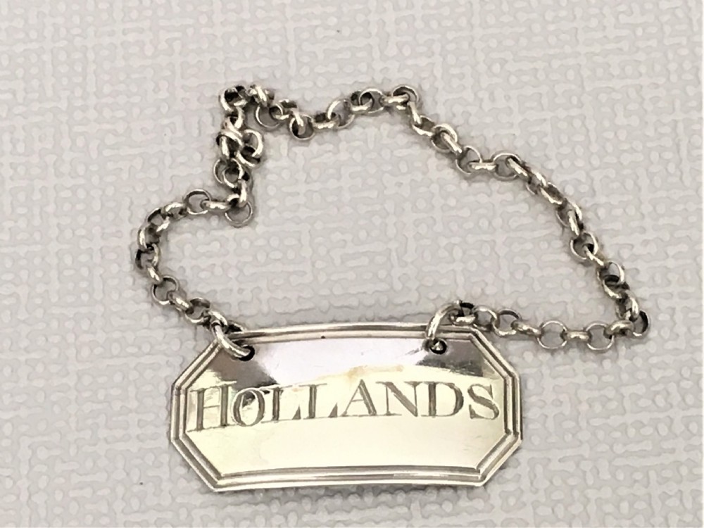 A lovely Georgian silver 'Hollands' decanter label