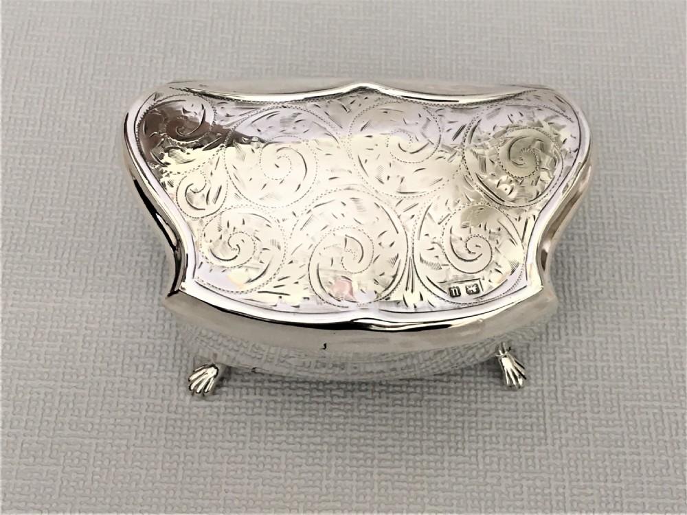 A shaped silver trinket box with engraved decoration View IV