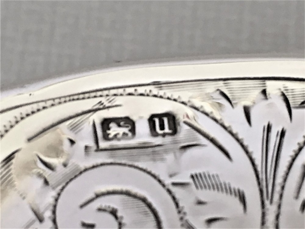 A shaped silver trinket box with engraved decoration View VII