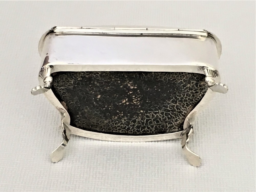 A shaped silver trinket box with engraved decoration View VIII