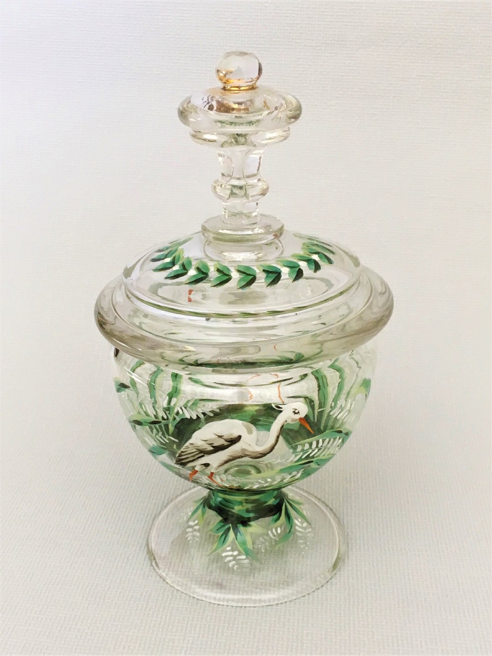 A charming enamel painted lidded sweetmeat jar