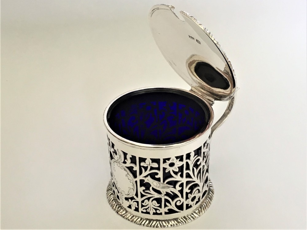 A superb pierced silver mustard pot with birds & flowers View V