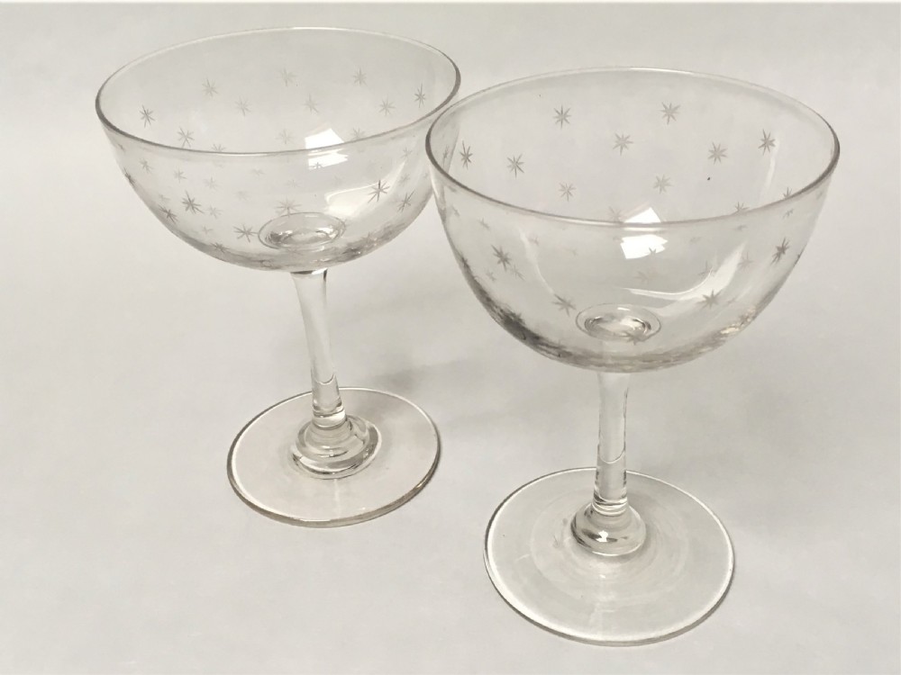 A pair of Victorian star etched champagne glasses