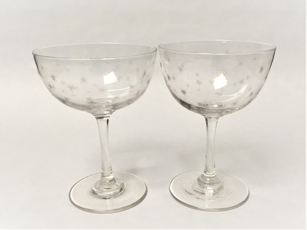 A pair of Victorian star etched champagne glasses View V