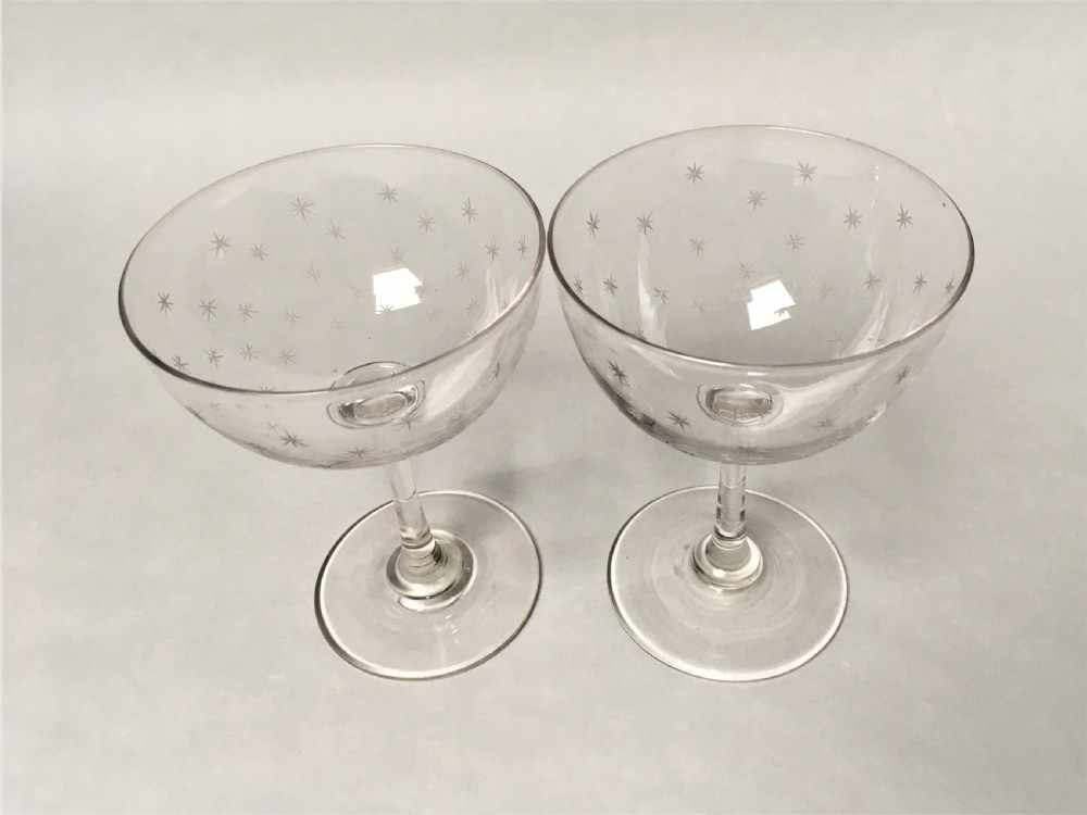 A pair of Victorian star etched champagne glasses View VI