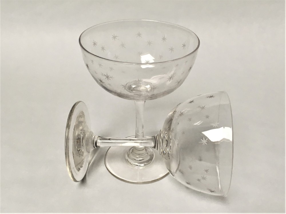 A pair of Victorian star etched champagne glasses View VII