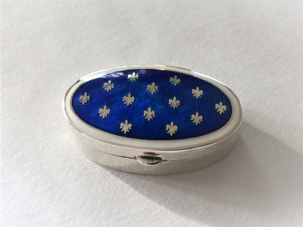 A fabulous silver & bi-coloured enamel pill box View VI