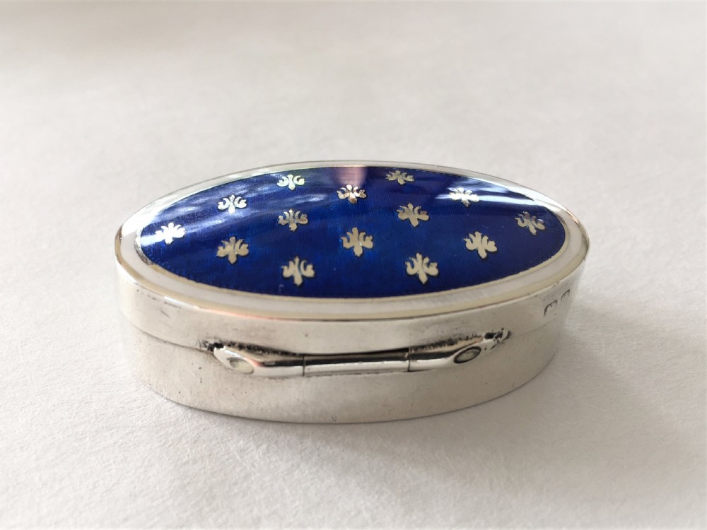 A fabulous silver & bi-coloured enamel pill box View IX