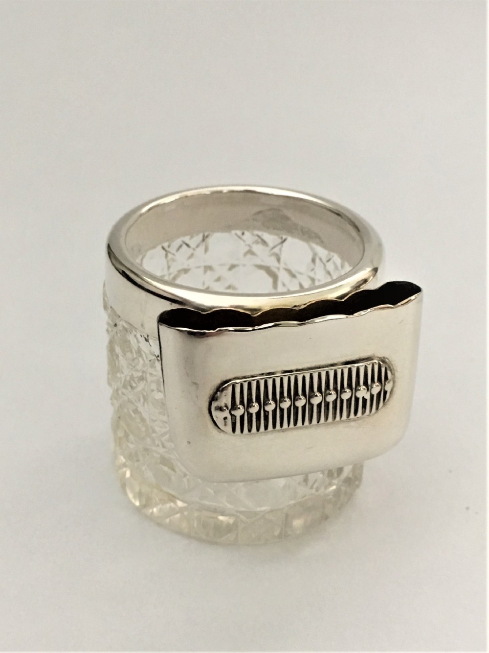 An unusual silver vesta/match striker pot