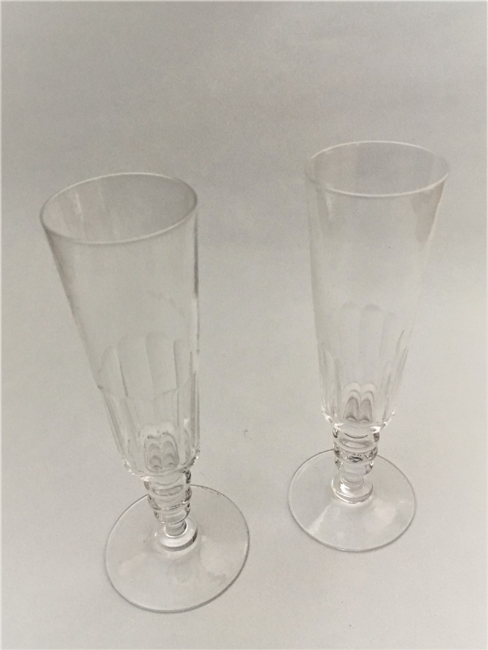A pair of French cut glass champagne flutes