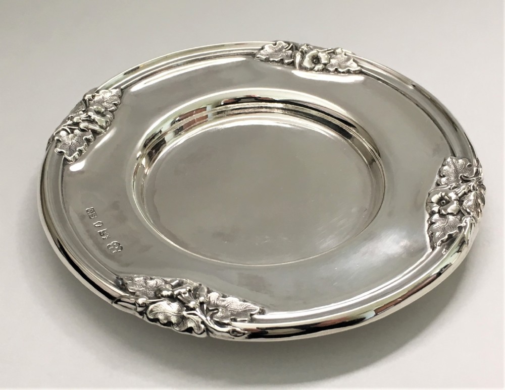 A magnificent William IV silver wine bottle/decanter coaster
