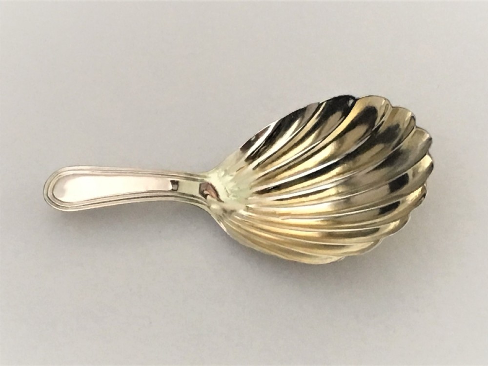 An 18th Century silver gilt caddy spoon