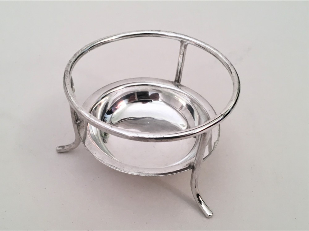 A charming silver tea strainer & drip cup View V
