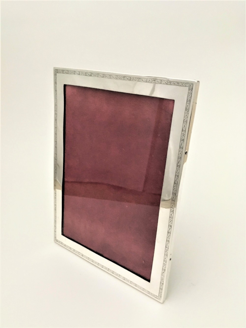 A fine portrait/landscape silver photo frame