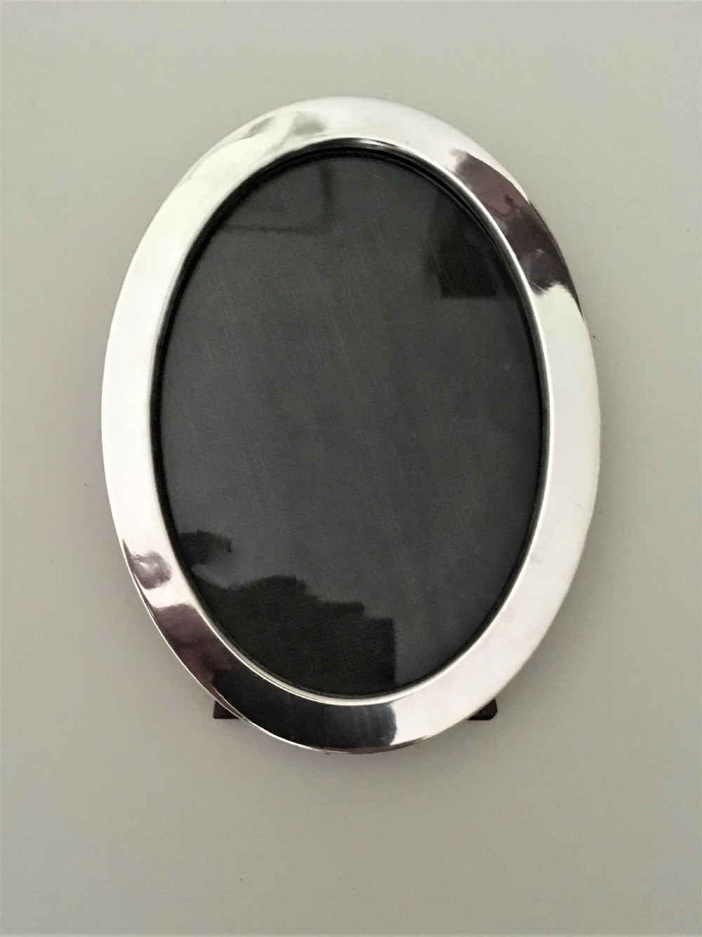 A handsome oval silver photo frame View VI