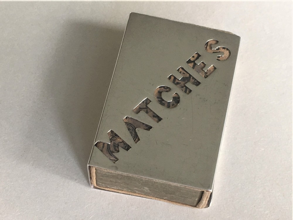 A collectable silver match box case