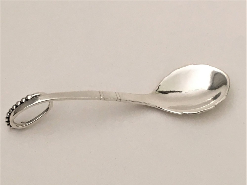 A superb Georg  Jensen silver preserve spoon