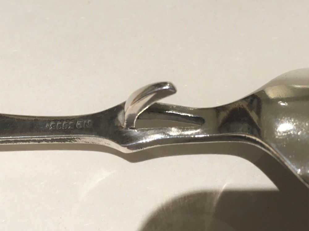 A desirable George V silver honey spoon View IV
