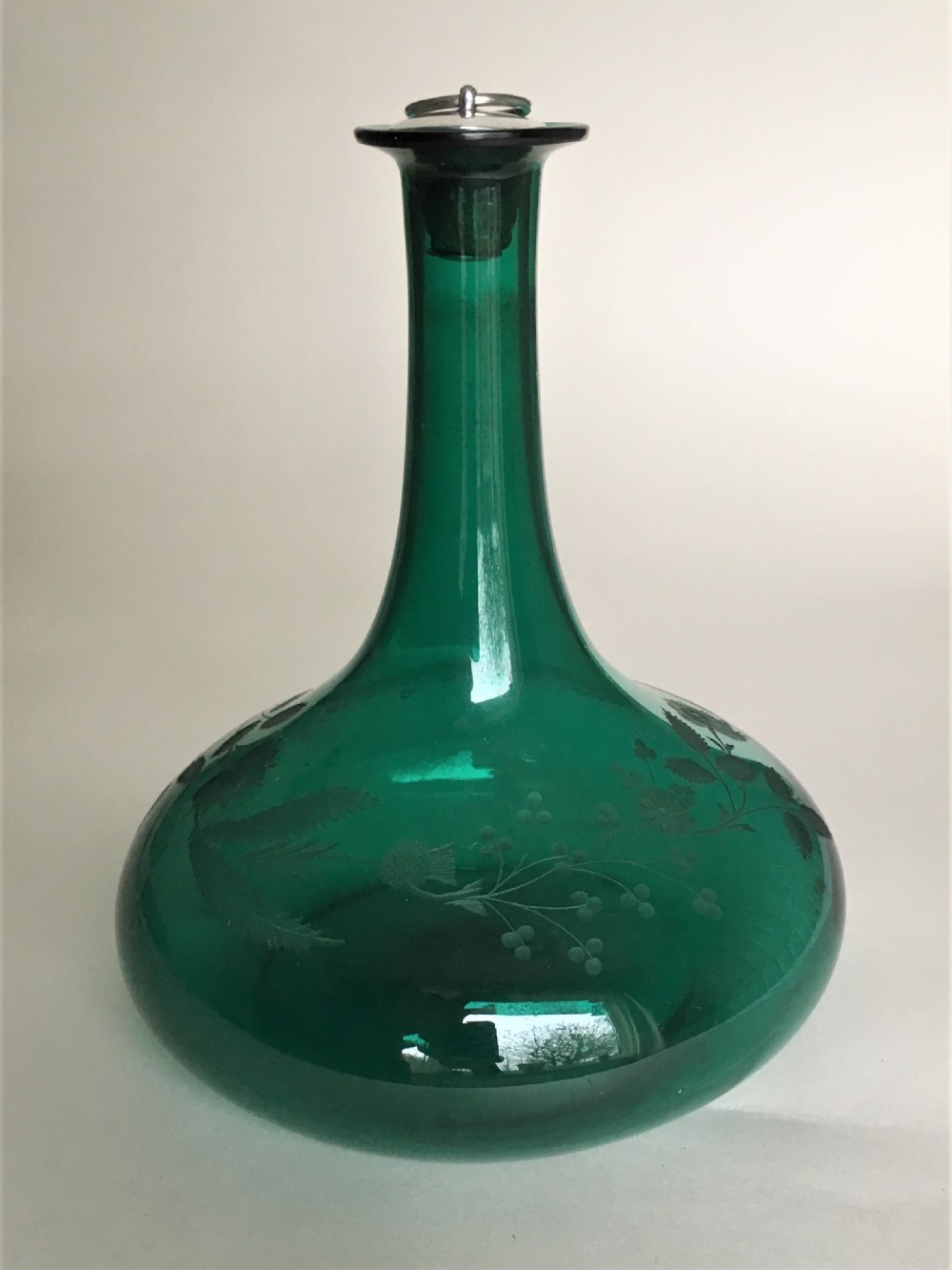 A Georgian Bristol Green decanter with silver stopper