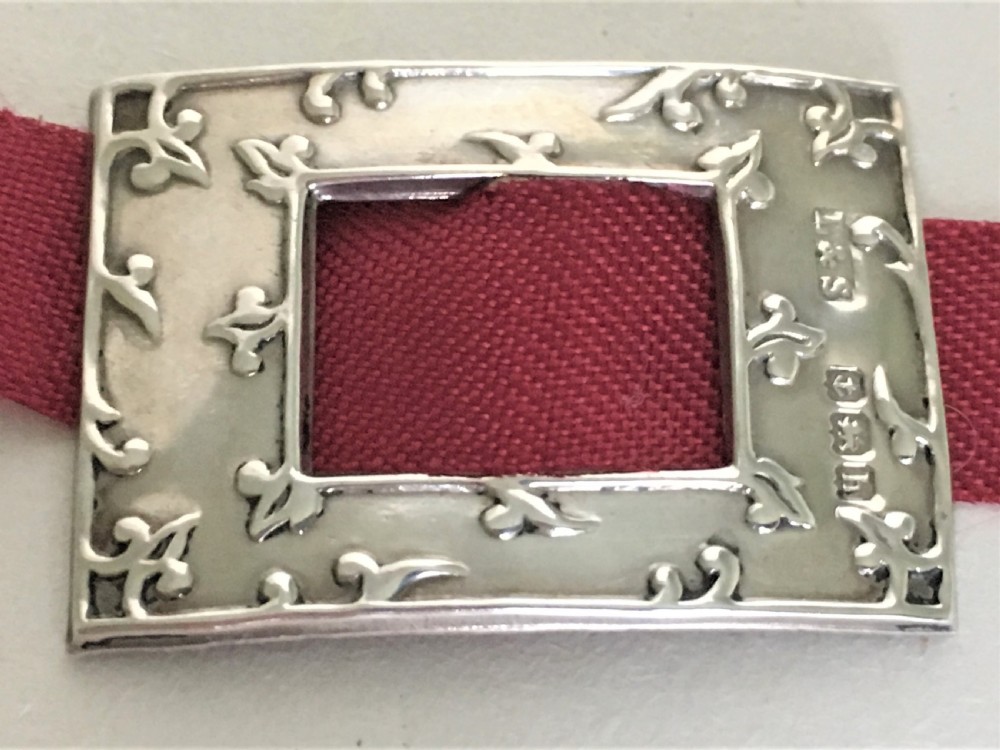 A delightful pair of Edwardian silver shoe buckles View II
