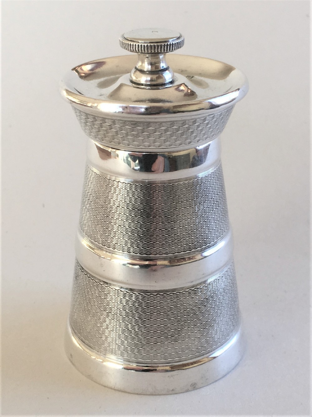 A handsome Art Deco silver pepper grinder