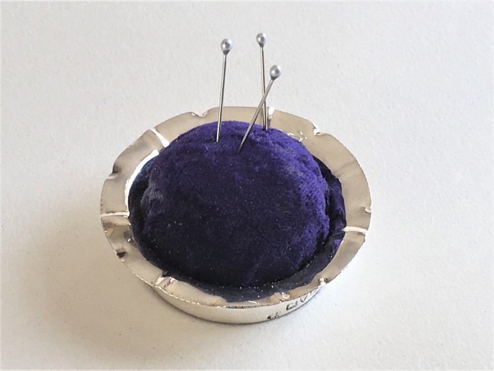 An unusual novelty Chester silver 'pie' pin cushion