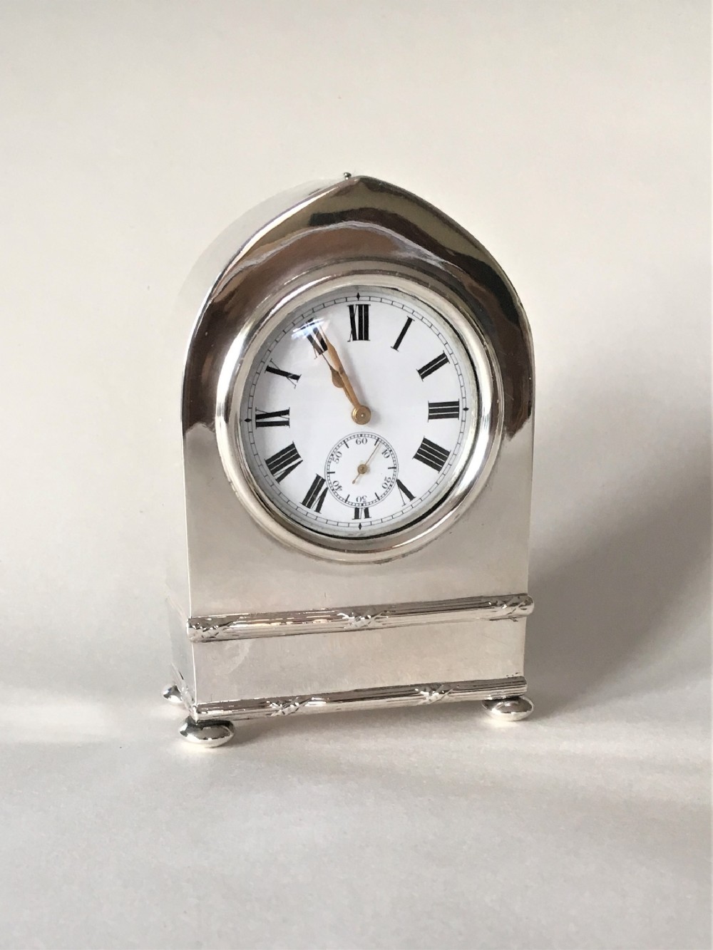 A superb Edwardian small silver clock