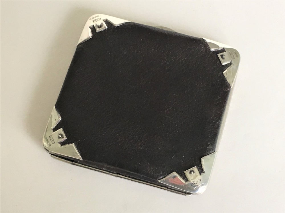 An Edwardian silver mounted leather wallet