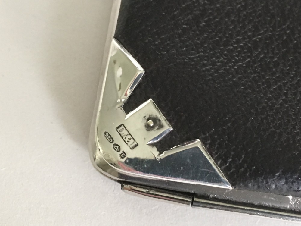 An Edwardian silver mounted leather wallet View IV