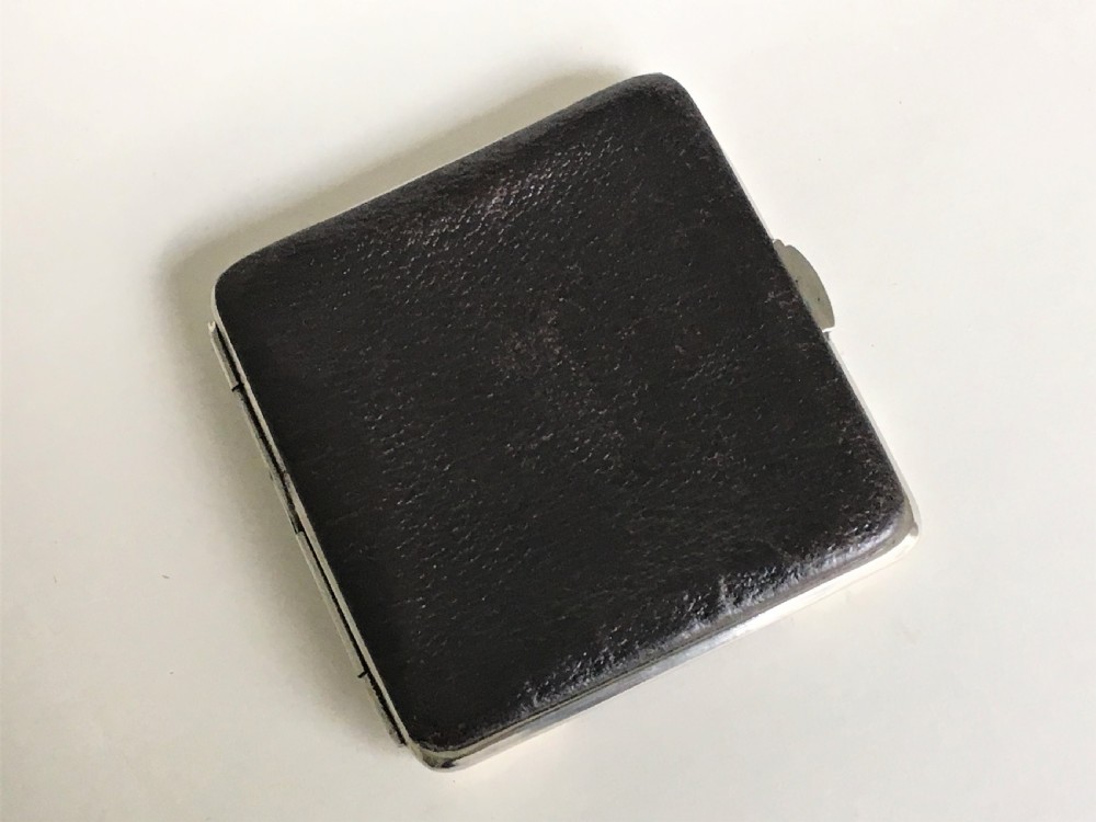 An Edwardian silver mounted leather wallet View VIII