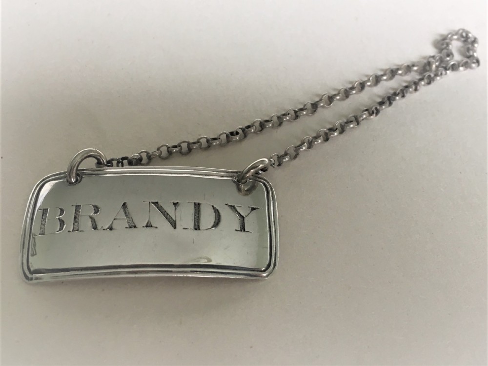 A fine Georgian silver Brandy decanter label