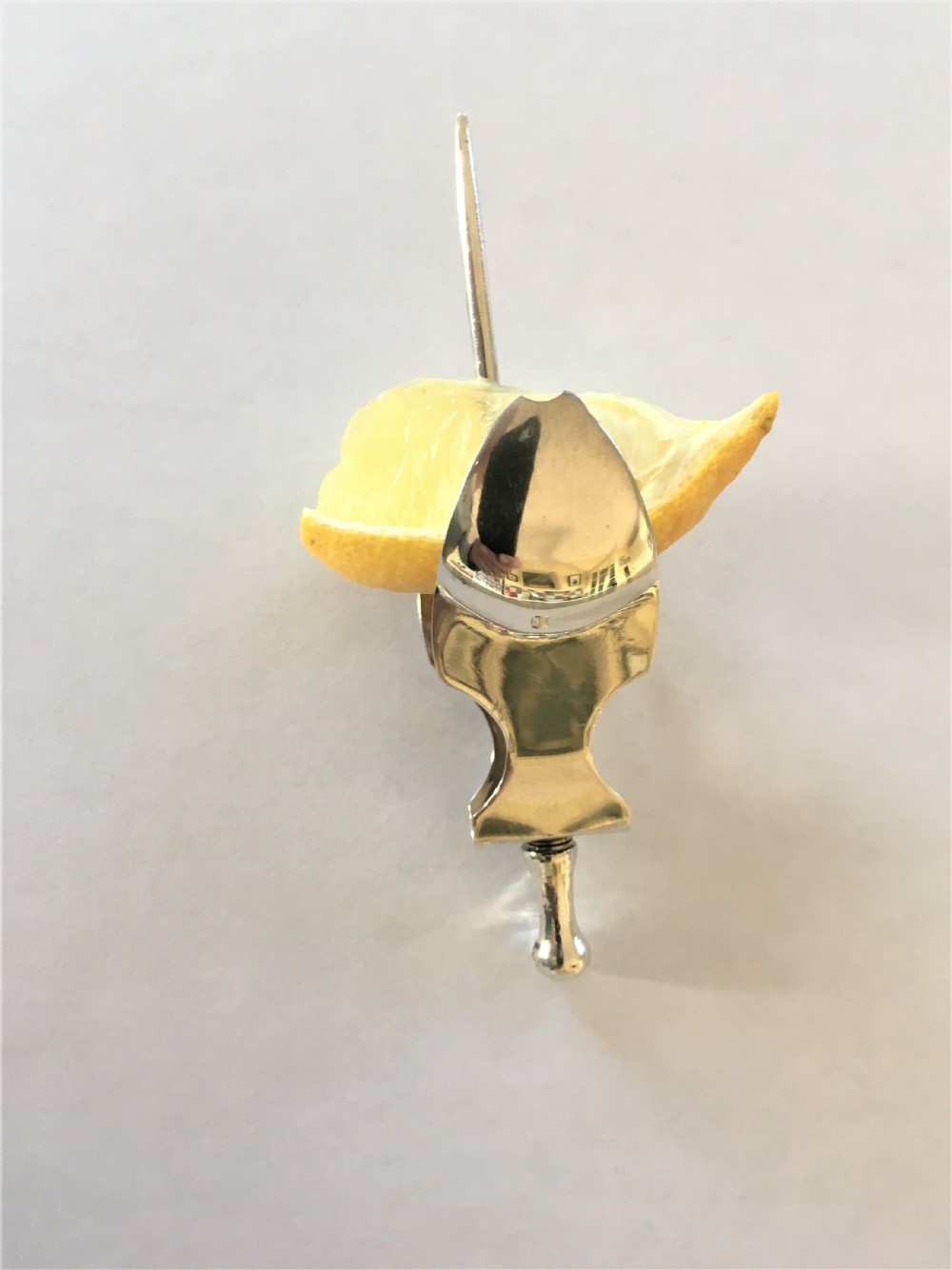 An extremely rare silver lemon squeezer View V