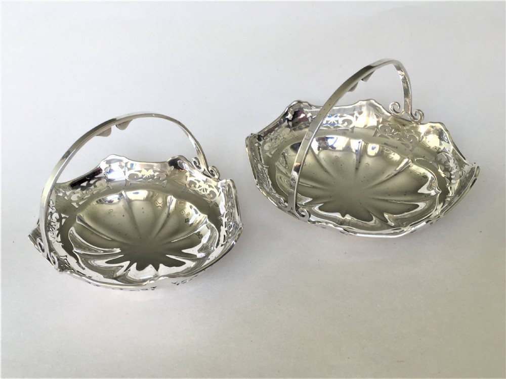 A charming pair of silver bonbon baskets