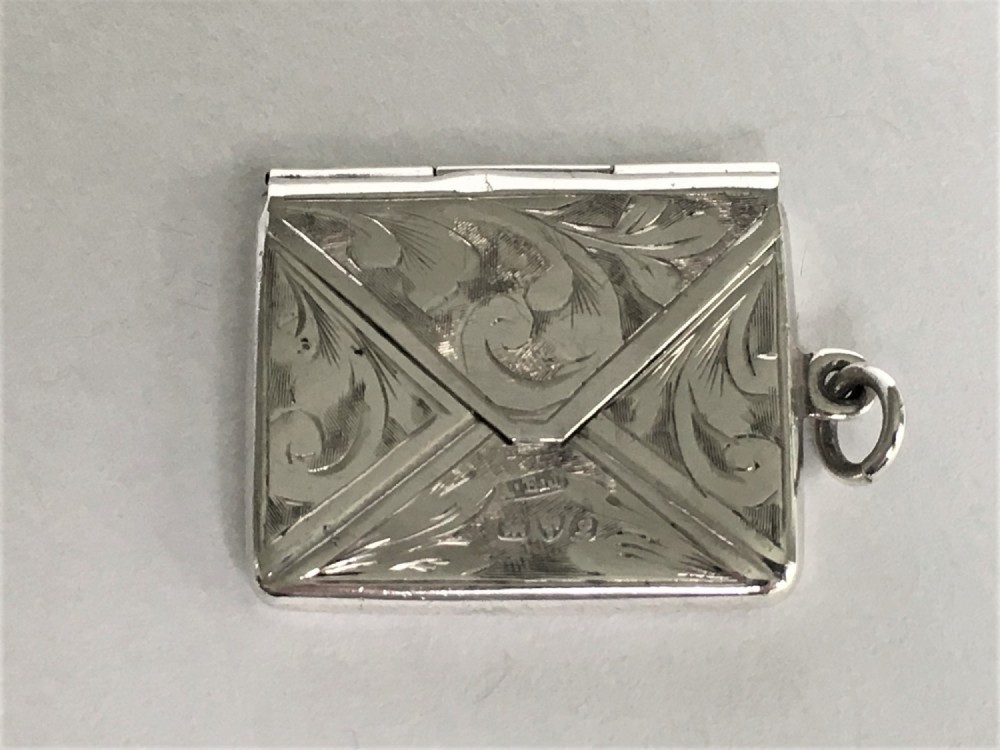 A charming George V silver stamp case