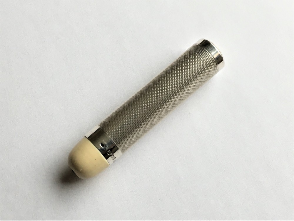 A stylish Art Deco silver theatre programme torch