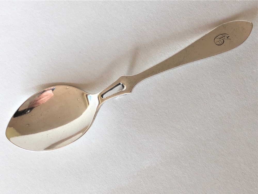An Edwardian silver honey spoon of patented design