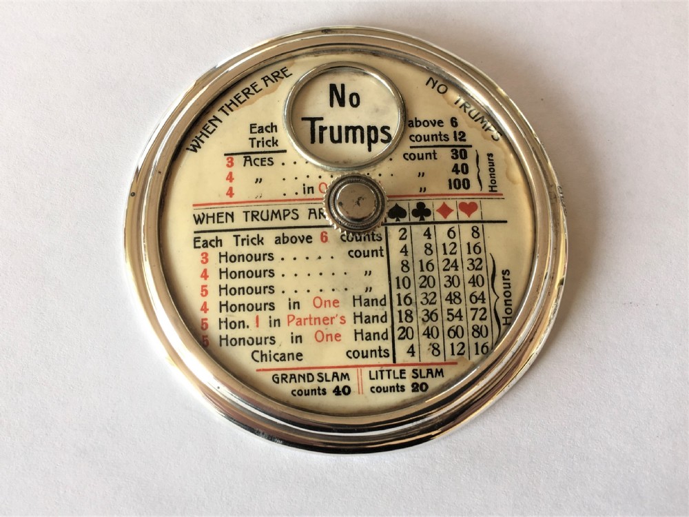 A rare Edwardian silver trump marker with rules