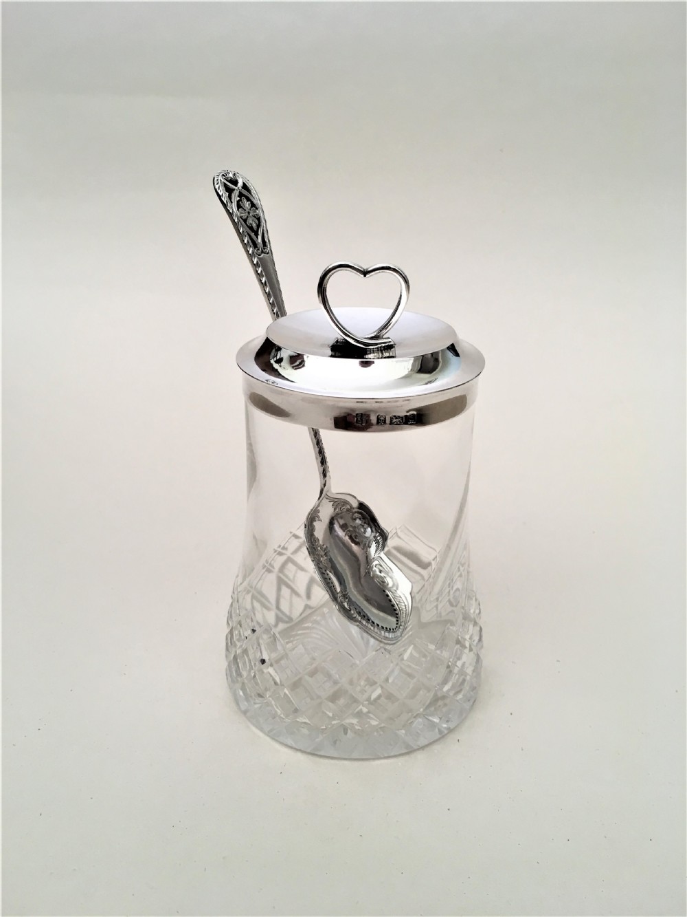An Edwardian silver mounted 'heart' finial preserve jar & spoon View IV