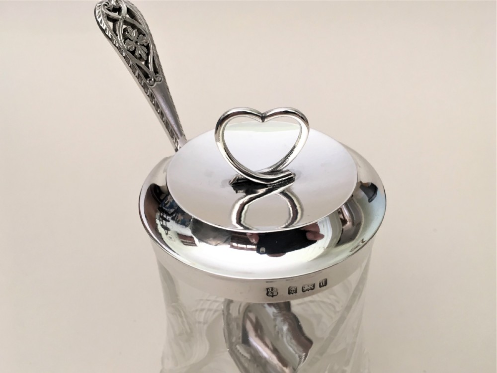 An Edwardian silver mounted 'heart' finial preserve jar & spoon View V