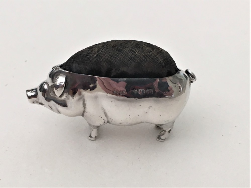 A sought after silver pig pin cushion