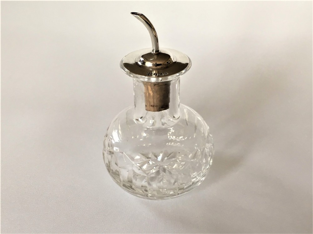 A silver mounted Angostura Bitters jigger
