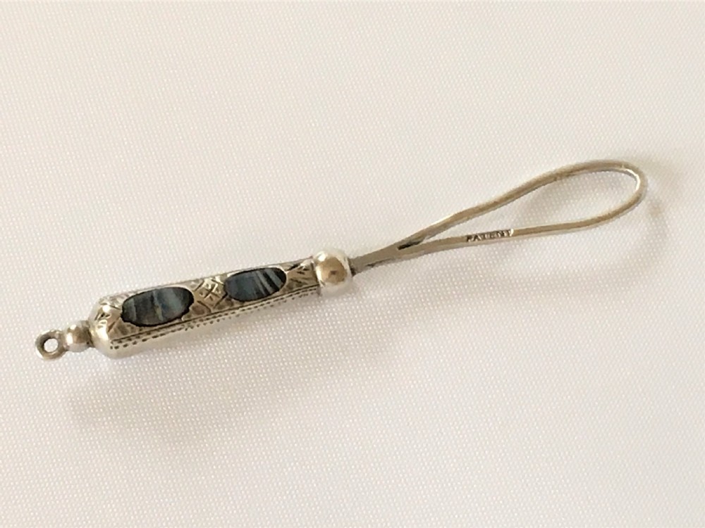A gorgeous Victorian silver & agate ribbon threader