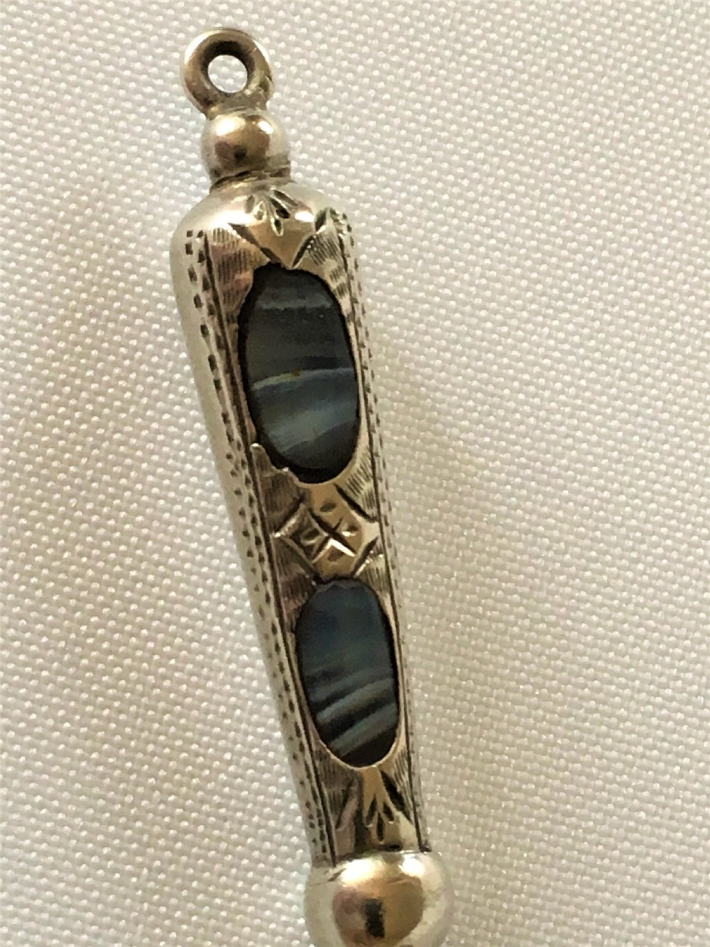 A gorgeous Victorian silver & agate ribbon threader View V