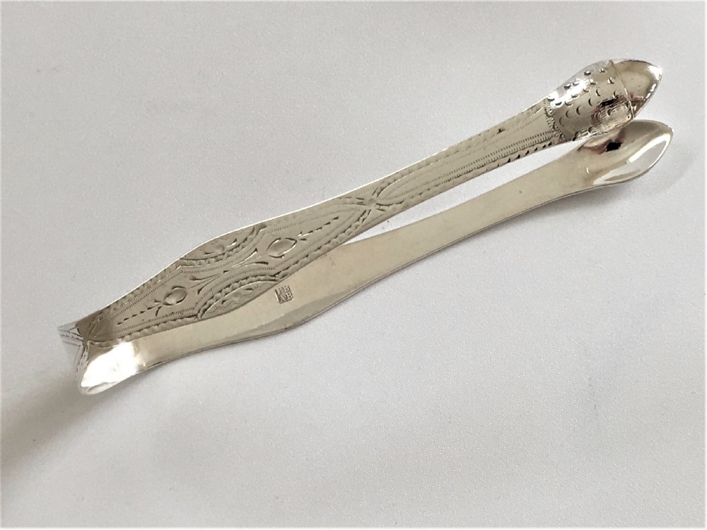 A gorgeous pair of 18th Century silver tongs