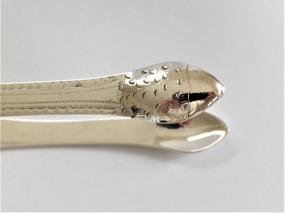 A gorgeous pair of 18th Century silver tongs View II